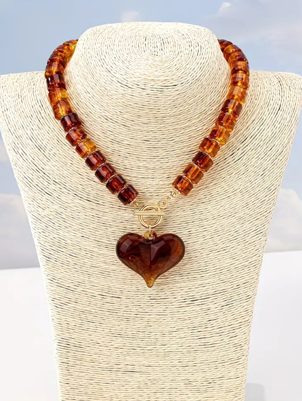 Amber colored acrylic necklace; 15.7" without the heart; nwot